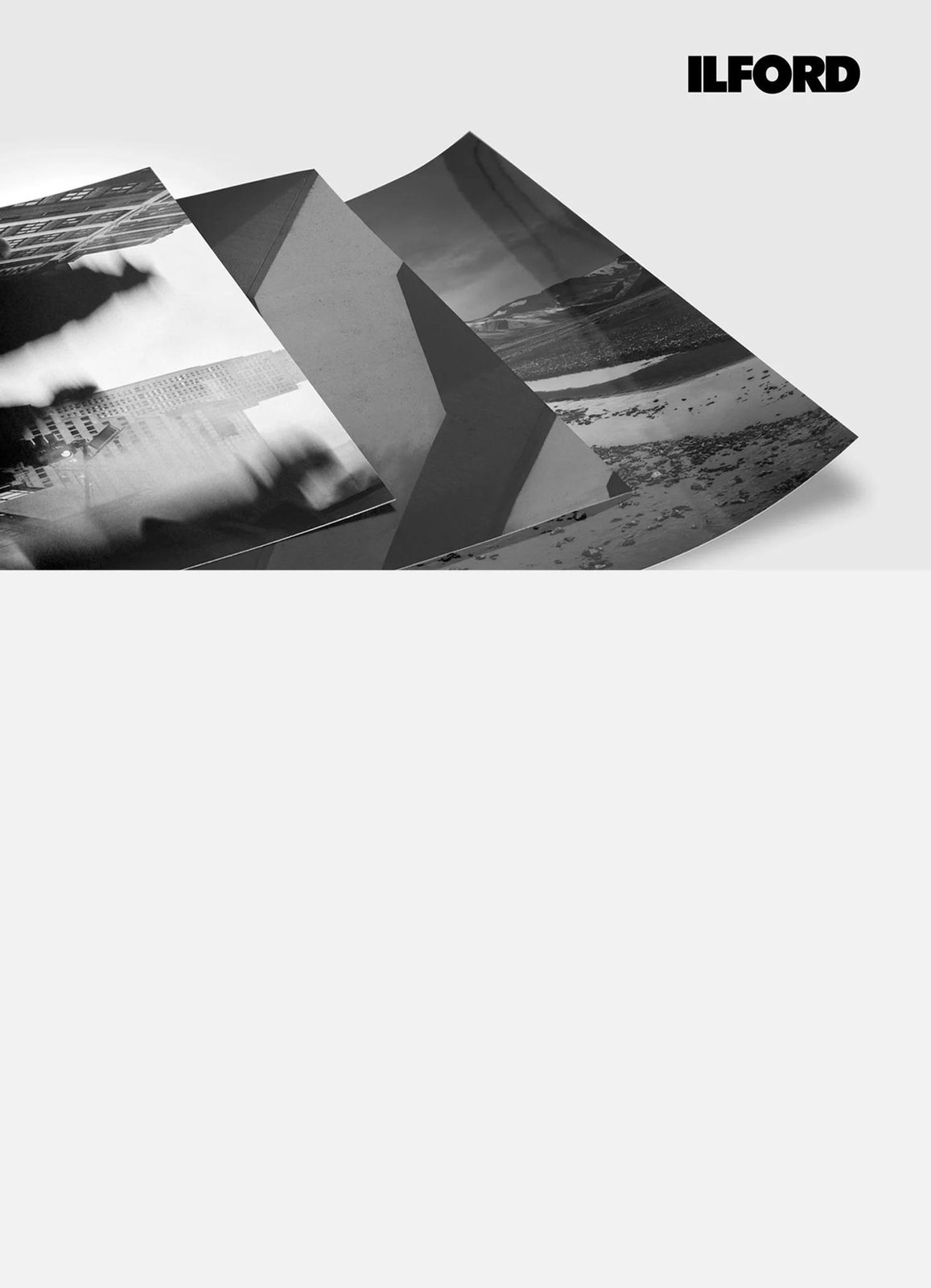 Three black and white prints on a light table